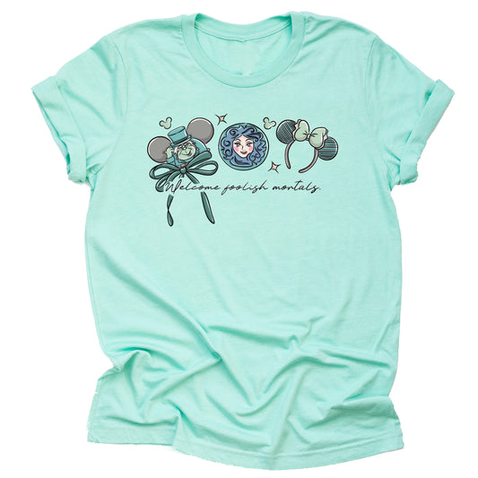 Mint green shirt with welcome foolish mortals text, character from Disney's haunted mansion