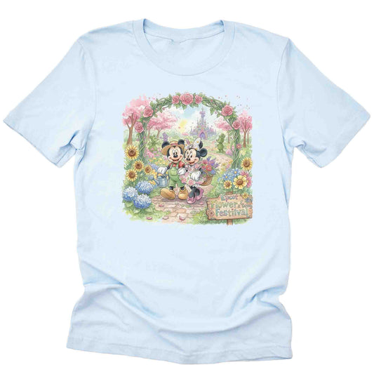 light blue shirt with mickey mouse and minnie mouse walking through a garden at Epcot's International Flower and garden festival