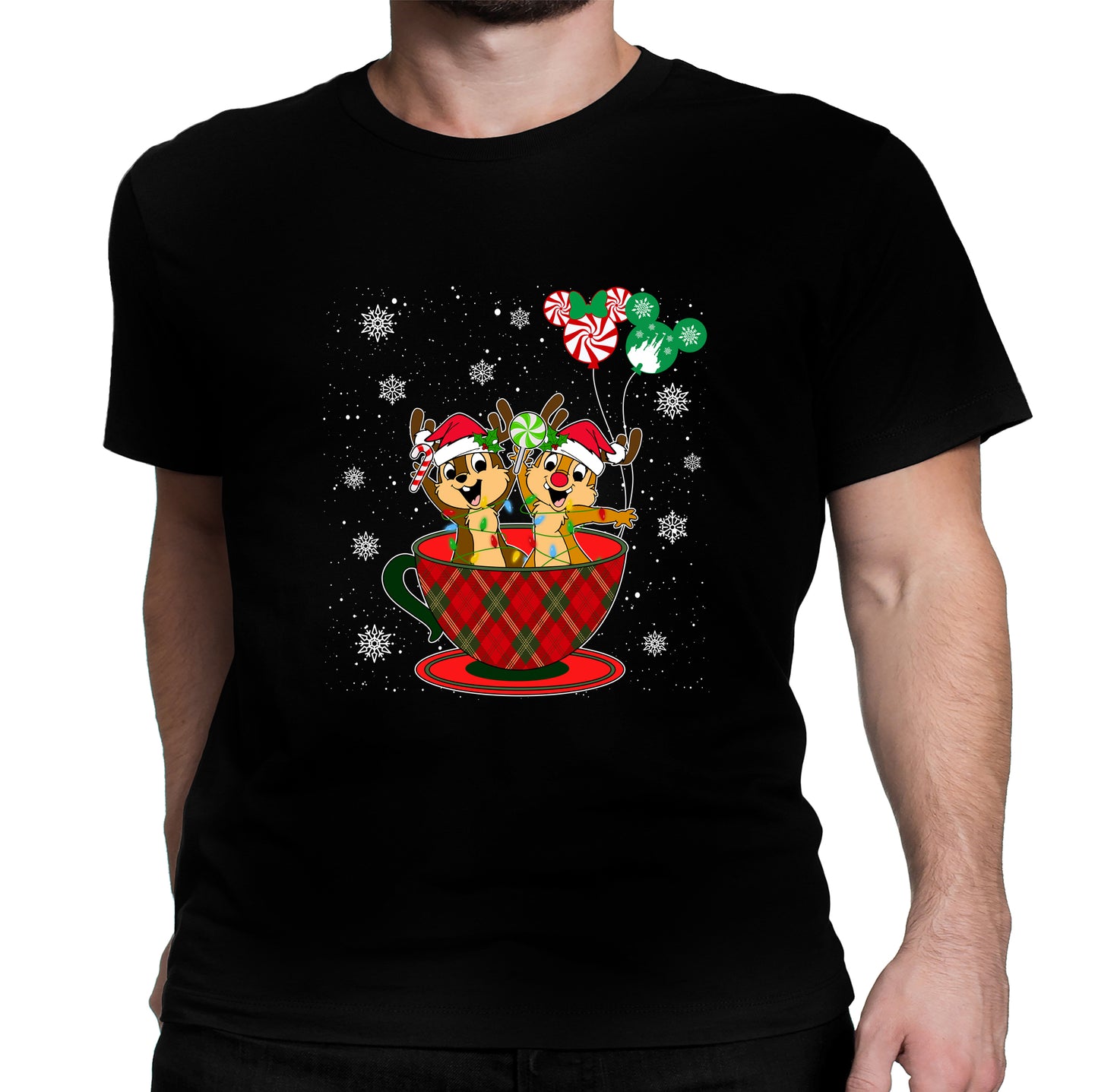 A man wearing black unisex t-shirt with a graphic design featuring Chip and Dale in a Christmas themed setting, including a cup and balloons.