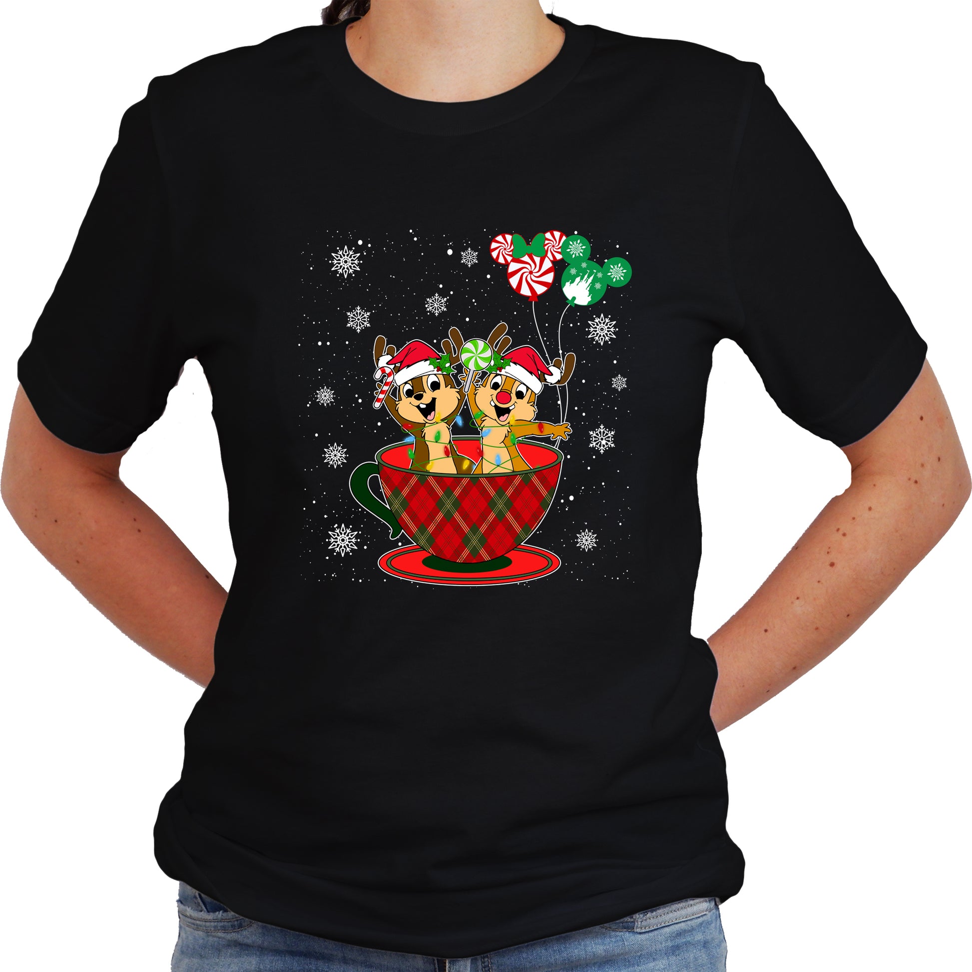 A women wearing black unisex t-shirt with a graphic design featuring Chip and Dale in a Christmas themed setting, including a cup and balloons.