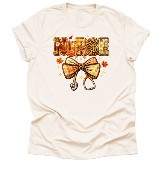 Cream fall nurse shirt with autumn bow design for RN nurses and healthcare workers