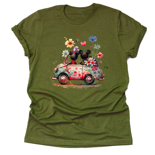 A olive unisex t-shirt featuring an artwork of Mickey and Minnie Mouse in a car surrounded by flowers.