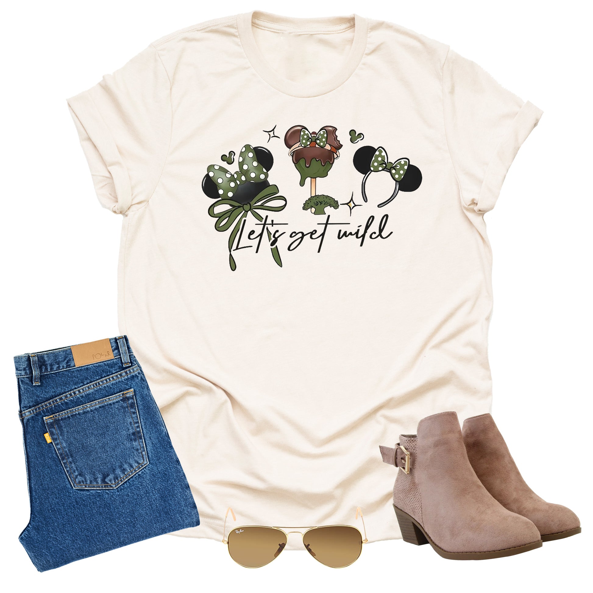 Beige t-shirt with Disney graphic design, text "let's get wild" blue jeans, brown boots, and sunglasses on a white background
