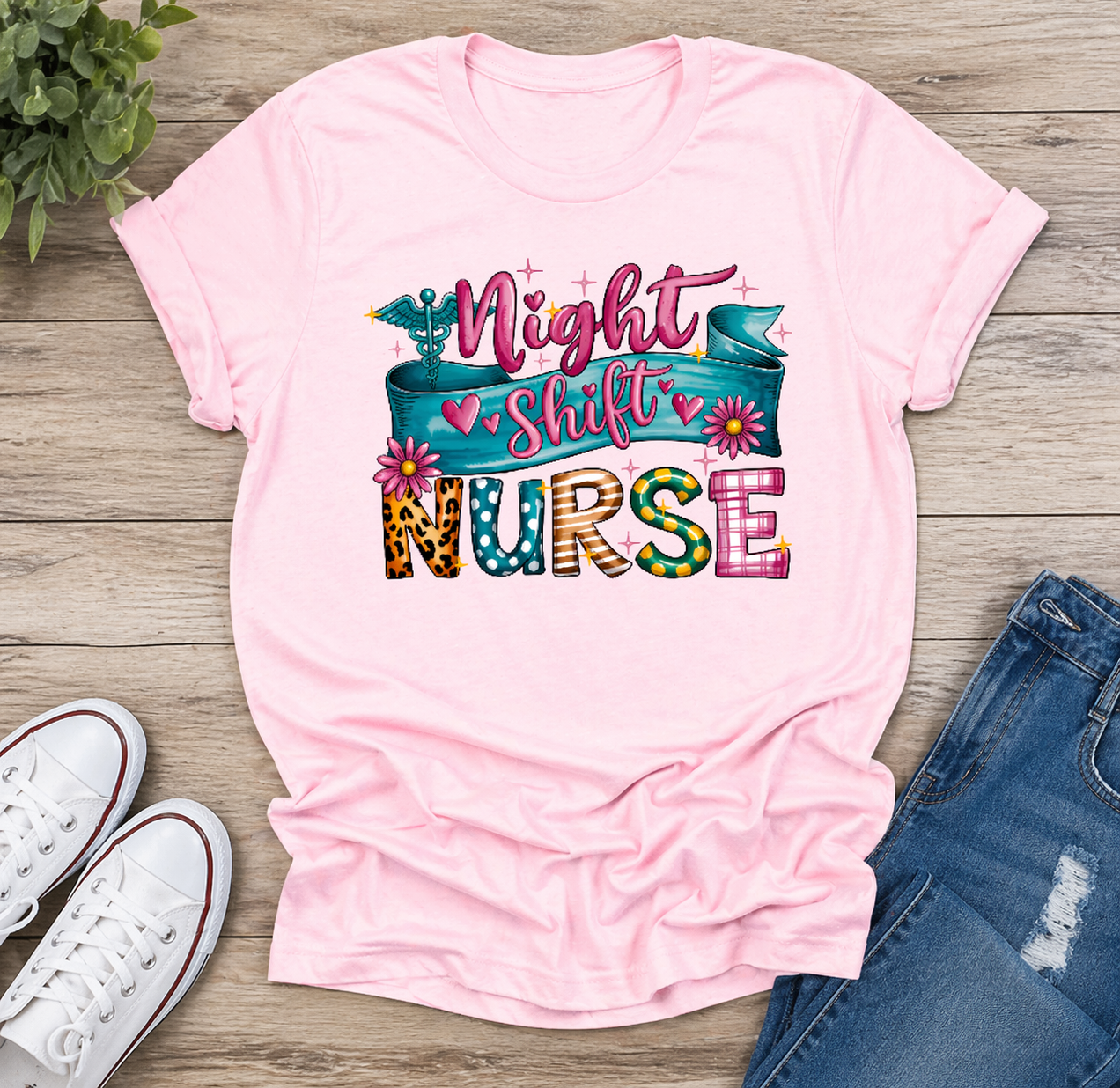 Light pink night shift nurse shirt with bold “Night Shift Nurse” graphic for RN nurses and healthcare workers