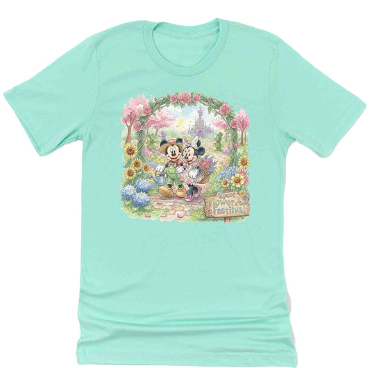 mint green shirt with mickey mouse and minnie mouse walking through a garden at Epcot's International Flower and garden festival