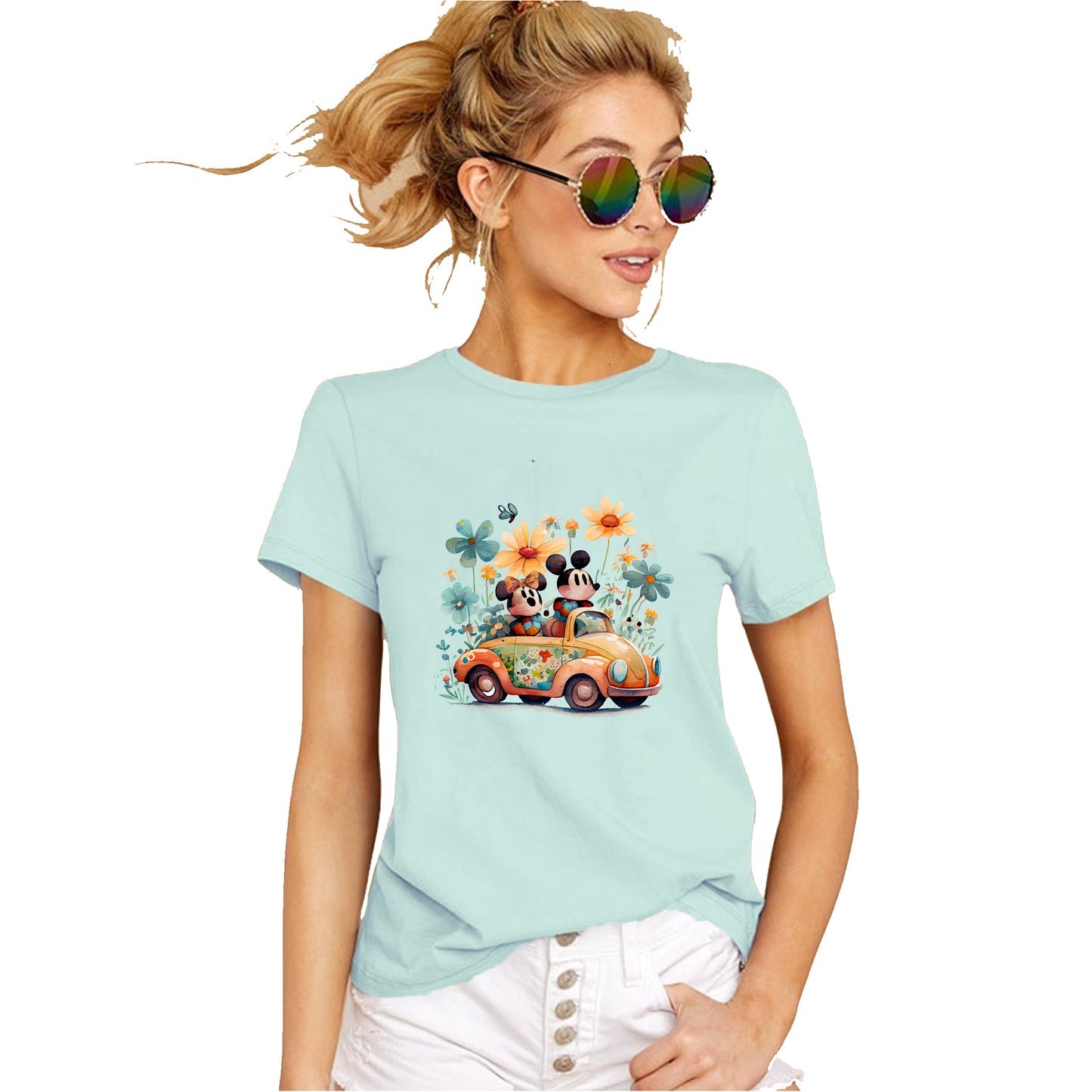 A person wearing a mint t-shirt with an illustration of Mickey and Minnie Mouse in a car surrounded by floral elements.