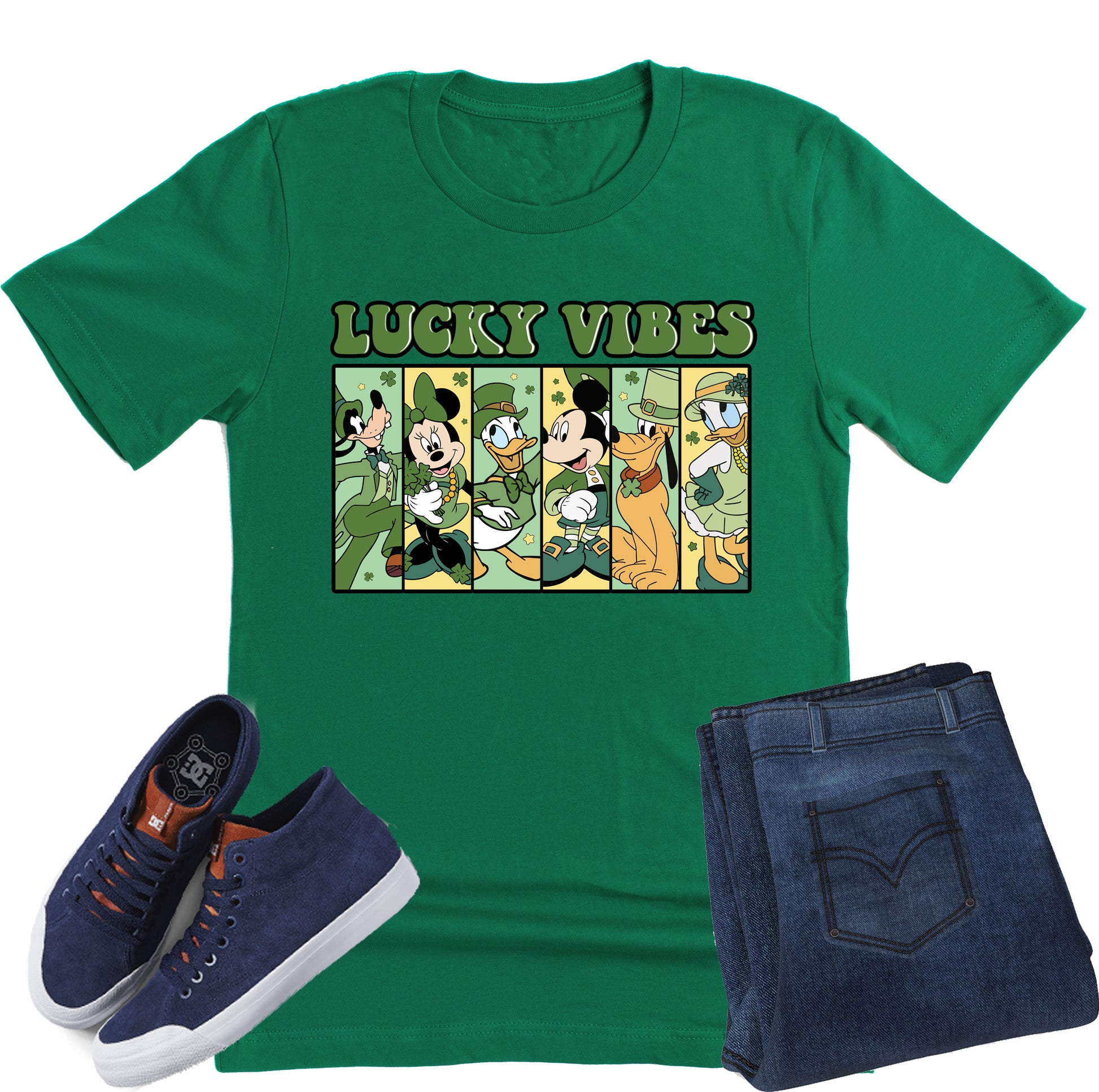 Green t-shirt with cartoon characters and 'Lucky Vibes' text, paired with navy sneakers and jeans on a white background.