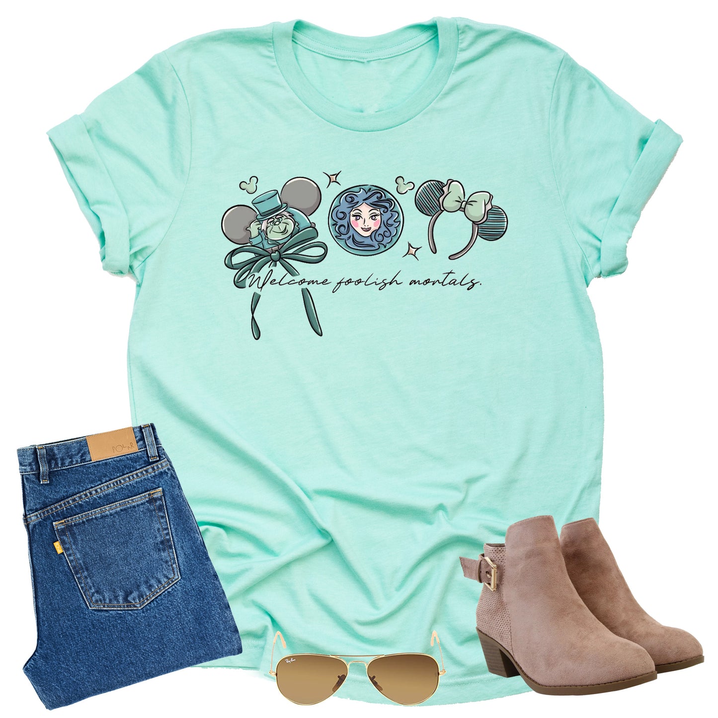 Mint green shirt with welcome foolish mortals text, character from Disney's haunted mansion
