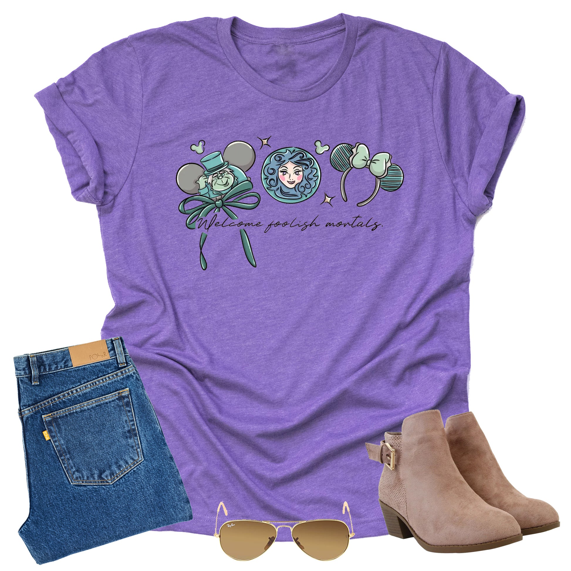 purple shirt with welcome foolish mortals text, character from Disney's haunted mansion blue jeans, tan boots, and sunglasses on a white background